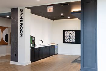 A room with a sign that says game room.